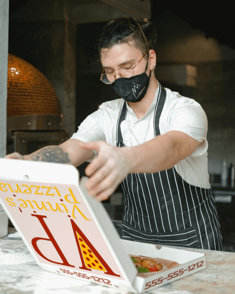 Vinnie's Pizzeria chef boxing pizza mock-up. Branding design.